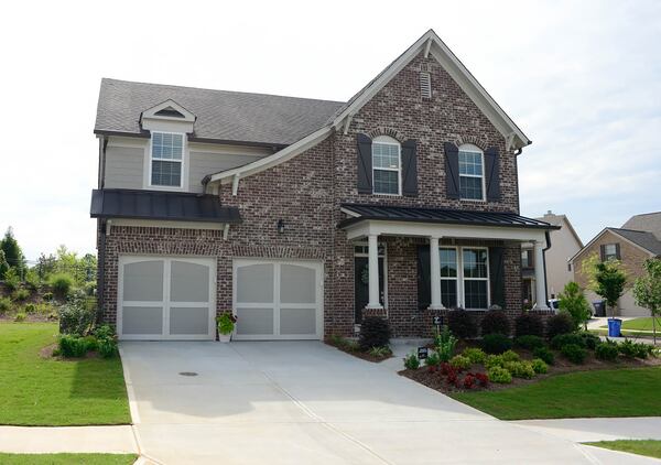 The Wares built their 3,000-square-foot Cherokee County home through Ashton Woods and moved in this year. The four-bedroom house has 3 1/2 bathrooms. Many of the finishes were selected through Ashton Woods, like the Belle Grae brick on the exterior.