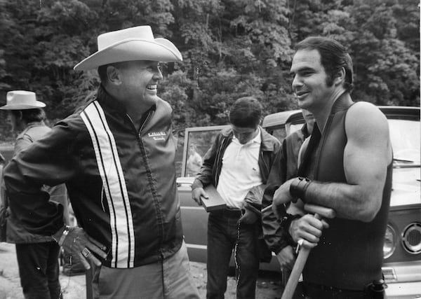 Poet, novelist and screenwriter James Dickey chats with star Burt Reynolds on the set of 1972’s “Deliverance.”