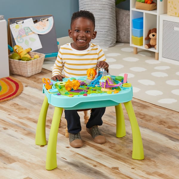 A creative Play-Doh station has a dual-sided tabletop, accessories and vibrant jars of the moldable compound.
(Courtesy of Hasbro)