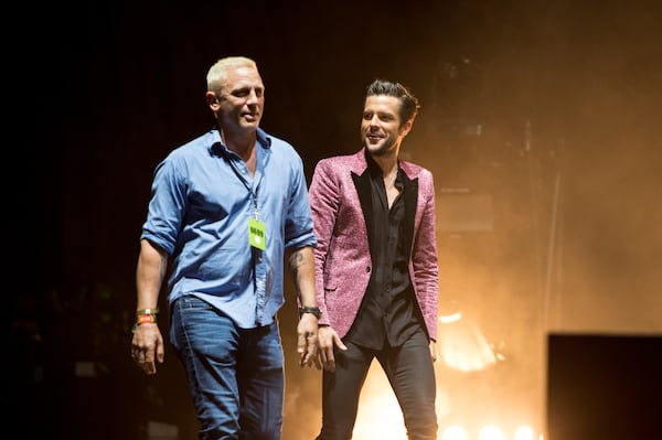 Daniel Craig and Brandon Flowers walk onstage at Music Midtown. Photo: Rob Loud