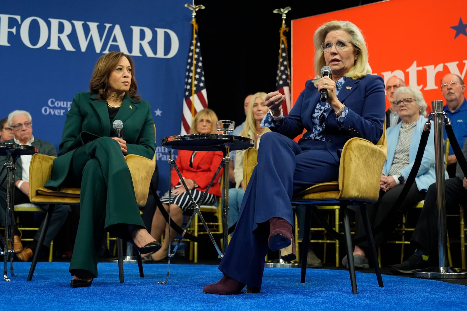 Former Republican Congresswoman Liz Cheney speaks as Democratic presidential nominee Vice President Kamala Harris listens during a town hall at The People's Light in Malvern, Pa., Monday, Oct. 21, 2024. (AP Photo/Jacquelyn Martin)