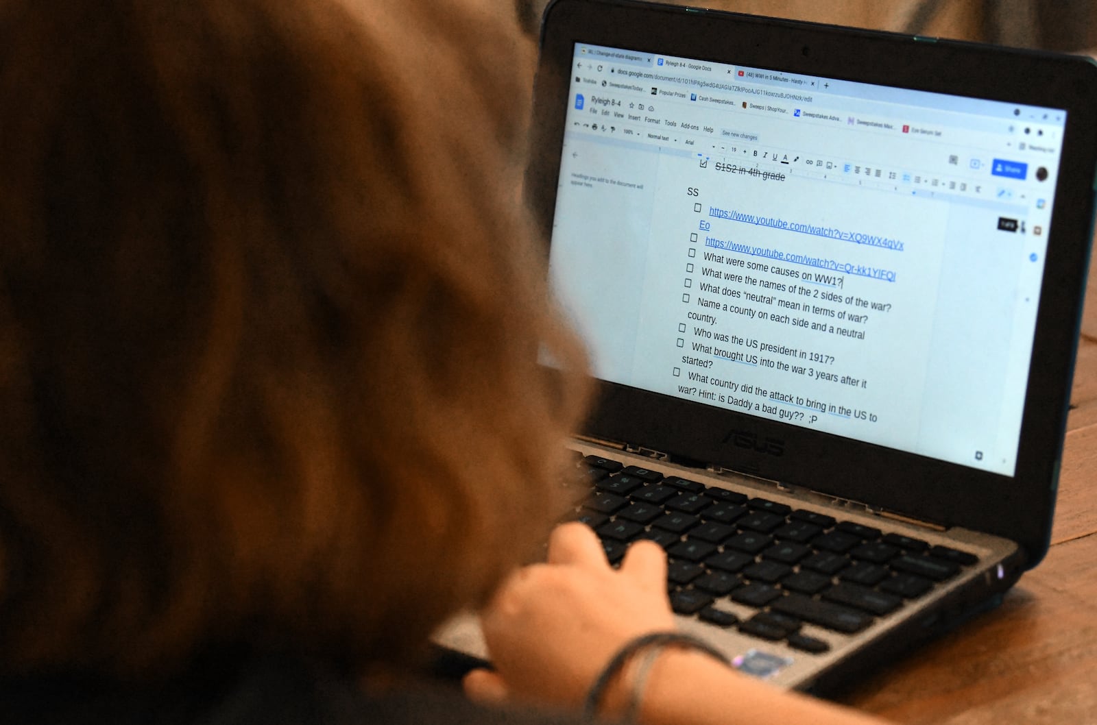 Ryleigh, 10, checks her google document while she and her sister Zoie (not pictured), 9, are homeschooling on Aug. 25, 2021. The parents pulled them out of Kemp Elementary in Cobb County because the district has no mask mandate and they could not enroll in a virtual program. (Hyosub Shin / Hyosub.Shin@ajc.com)