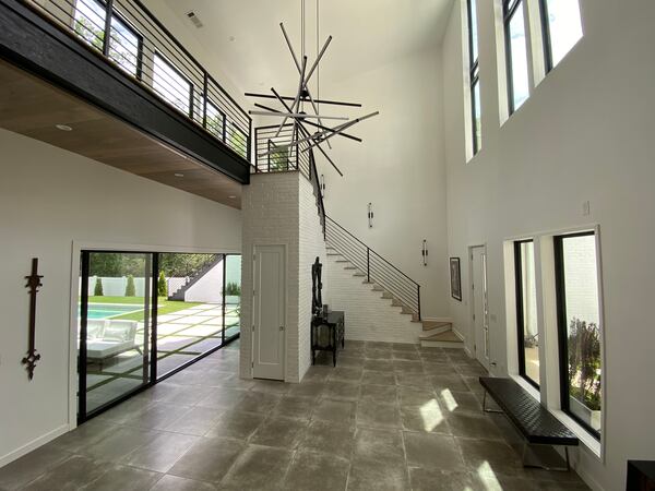 William Treadwell and Jesse Lirette's modern industrial home features an open floor plan with tons of natural light throughout. Courtesy of Helen Chen