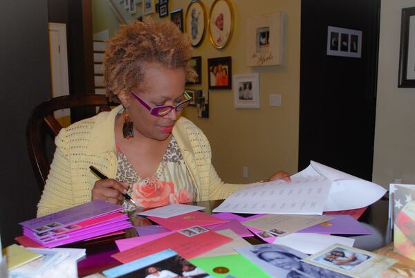 Carrie Salone of Atlanta readies greeting cards to send to moms here and across the country for Mother’s Day. Salone’s daughters Alleah and Ayana started the practice to honor her mother and their grandmother, Leila Johnson, after her death. CONTRIBUTED BY CENTERCUTT PHOTOGRAPHY / ATLANTA