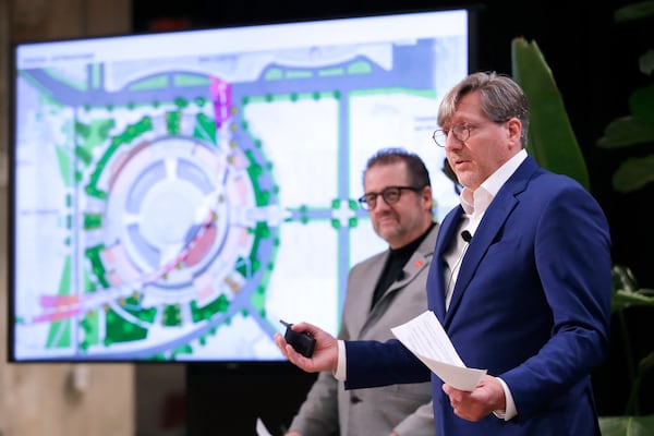 Jerry Alexander, left, and Kristopher Stuart, right, both principals with Gensler Architects, speak as they present artists renderings of proposed renovations for the now dormant Astrodome during a press conference put on by the Astrodome Conservancy held at The Ion Wednesday, Nov. 13, 2024, in Houston. (AP Photo/Michael Wyke)