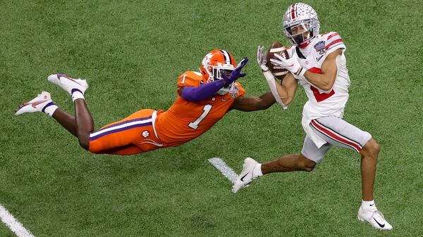 Ohio State wide receiver Chris Olave catches a touchdown pass in front of Clemson cornerback Derion Kendrick during the second half of the Sugar Bowl Friday, Jan. 1, 2021, in New Orleans. (Butch Dill/AP)