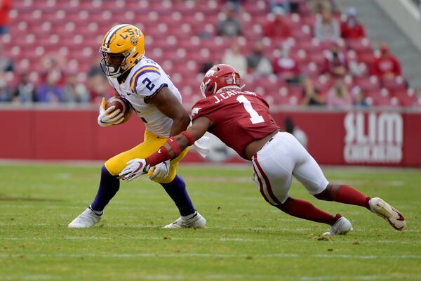 LSU tight end Arik Gilbert runs after catching a pass against Arkansas on Sunday, Jan. 31, 2021. (AP Photo/Michael Woods, File)