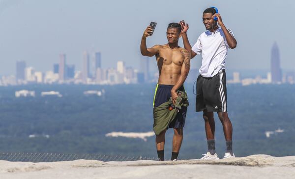 June 27, 2017 Stone Mountain: Georgia State rising junior, D’mani Williams-20 (left) and Kennesaw State rising junior, Jordon Ballou-20 did some mountain top selfies with the Atlanta skyline that was clearly visible from the top of Stone Mountain Tuesday, June 27, 2017. JOHN SPINK/JSPINK@AJC.COM.