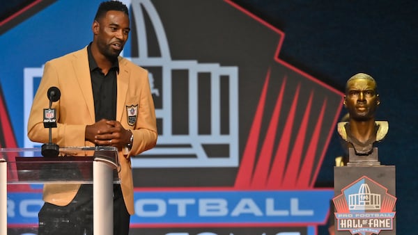 Calvin Johnson, a member of the Pro Football Hall of Fame Class of 2021, speaks during the induction ceremony at the Pro Football Hall of Fame, Sunday, Aug. 8, 2021, in Canton, Ohio. (David Richard/AP)