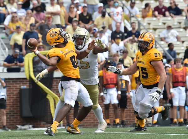 Kennesaw State quarterback Xavier Shepherd (8) gets tackled by Georgia Tech defensive lineman Jared Ivey (15) as he gets off a pass during the second half Saturday, Sept.11, 2021, at Bobby Dodd Stadium in Atlanta. (Hyosub Shin / Hyosub.Shin@ajc.com)