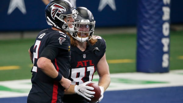 Falcons quarterback Matt Ryan (2) celebrated touchdown pass to tight end 
Hayden Hurst (81) in the first half against the Dallas Cowboys Sunday, Sept. 20, 2020, in Arlington, Texas. (Michael Ainsworth/AP)