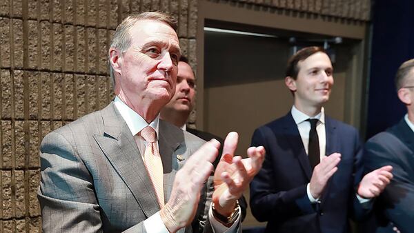 U.S. Sen. David Perdue applauds President Donald Trump during his speech at the Black Voices for Trump Coalition Rollout in November in Atlanta.