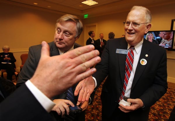 When Ralph Hudgens, right, was Georgia's insurance commissioner, he said a 2008 state law prevented him from stopping companies when they increased their rates for auto insurance by double digits. Hudgens was chairman of the Senate committee that backed that law. Curtis Compton ccompton@ajc.com