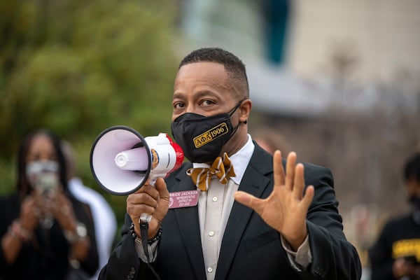 03/15/2021 —Atlanta, Georgia — Georgia Rep. Derrick Jackson (D-Tyrone) speaks to a group gathered to peacefully protest HB 531 and SB 241 outside of the World of Coca-Cola in downtown Atlanta, Monday, March 15, 2021. The group of activists from different organizations staged a die-in outside of the World of Coca-Cola to protest HB SB 241 and HB 531. These bills, which deal with the Georgia elections, aim to change the voting process. (Alyssa Pointer / Alyssa.Pointer@ajc.com)