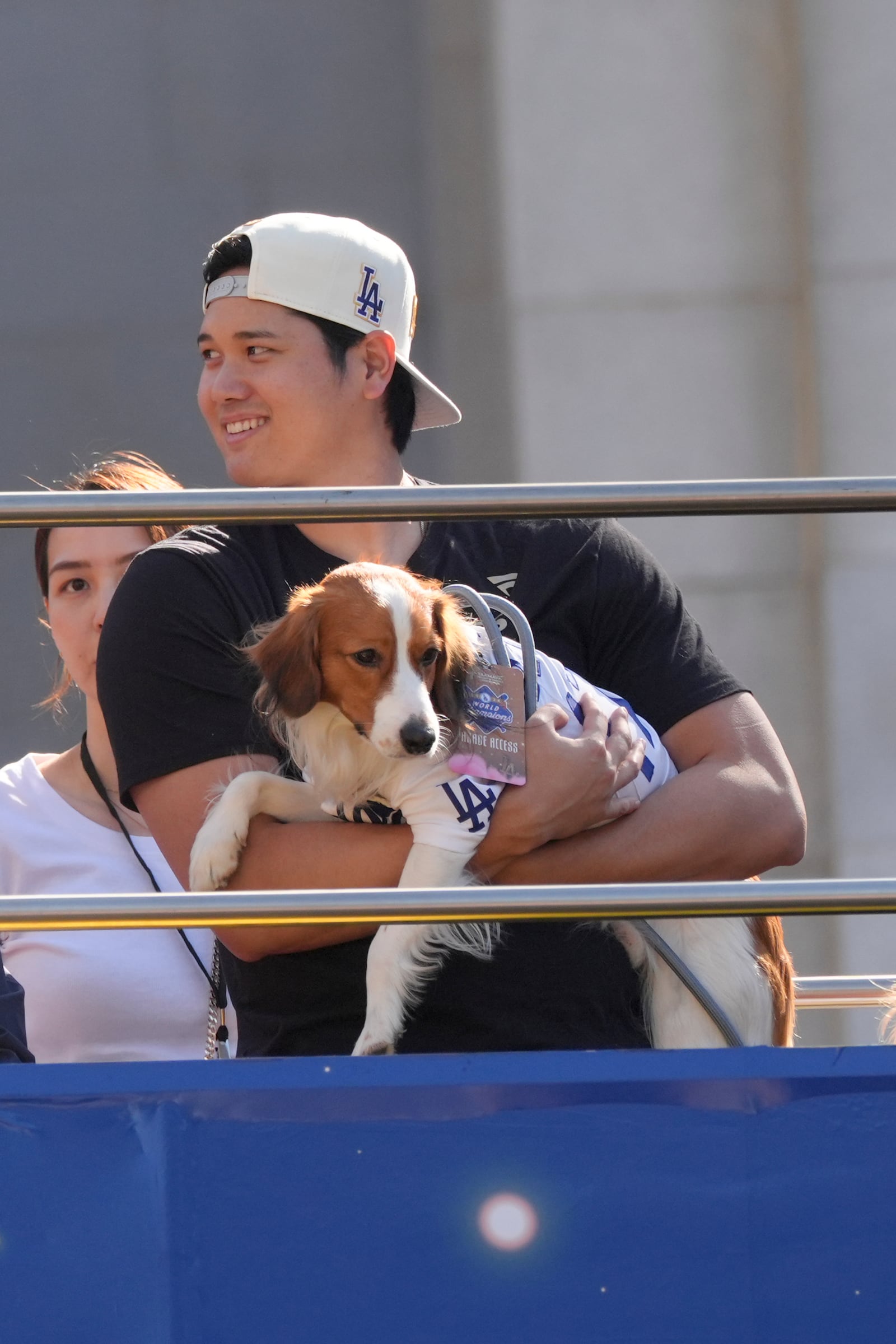 Los Angeles Dodgers' Shohei Ohtani holds his dog Decoy during the Los Angeles Dodgers baseball World Series championship parade Friday, Nov. 1, 2024, in Los Angeles. (AP Photo/Jae C. Hong)