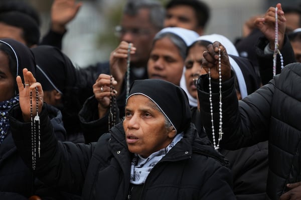 Nuns pray for Pope Francis in front of the Agostino Gemelli Polyclinic, where the Pontiff has been hospitalized since Feb.14, in Rome, Saturday, March 1, 2025. (AP Photo/Kirsty Wigglesworth)