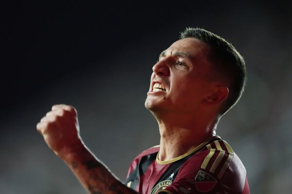 Atlanta United midfielder Bartosz Slisz (6) celebrates after scoring a goal during the second half of an MLS playoff opening round soccer match against Inter Miami, Saturday, Nov. 9, 2024, in Fort Lauderdale, Fla. (AP Photo/Rebecca Blackwell)