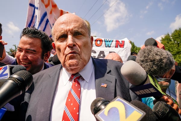 FILE - Rudy Giuliani speaks outside the Fulton County jail in Atlanta, on Wednesday, Aug. 23, 2023. (AP Photo/Brynn Anderson, File)