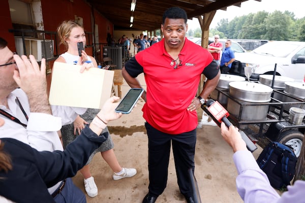 Senate candidate Herschel Walker addresses the media after a campaign event at the Northeast Georgia Livestock on Wednesday, July 20, 2022. Miguel Martinez / miguel.martinezjimenez@ajc.com 