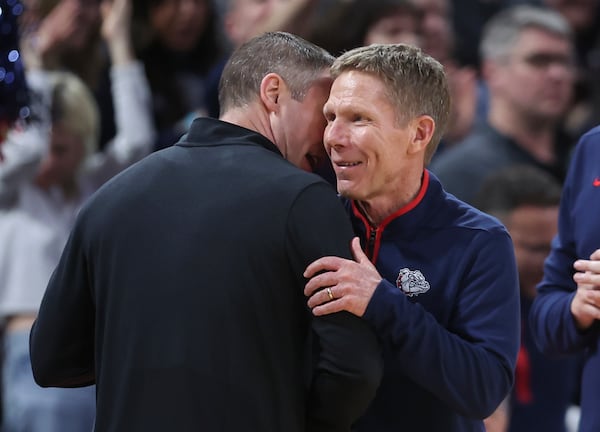 Gonzaga head coach Mark Few, left, speaks with Georgia head coach Mike White, right, after their game in the first round of the NCAA college basketball tournament, Thursday, March 20, 2025, in Wichita, Kan. (AP Photo/Travis Heying)