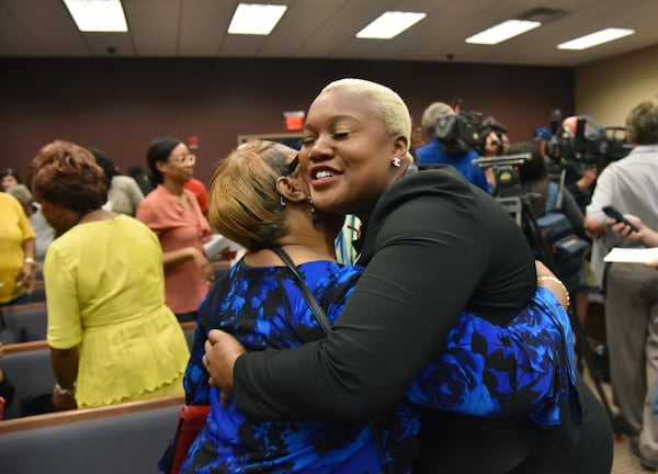 August 24, 2018 Cuthbert - Helen Butler (left) with Georgia Coalition for the People’s Agenda and Georgia State Representative Erica Thomas celebrate after Randolph County Board of Elections defeated a contentious proposal to close seven rural voting locations at Randolph County Government Center on Friday, August 24, 2018. The Randolph County Board of Elections voted 2-0 to save these precincts and preserve easy access to the polls for about 1,700 registered voters. HYOSUB SHIN / HSHIN@AJC.COM