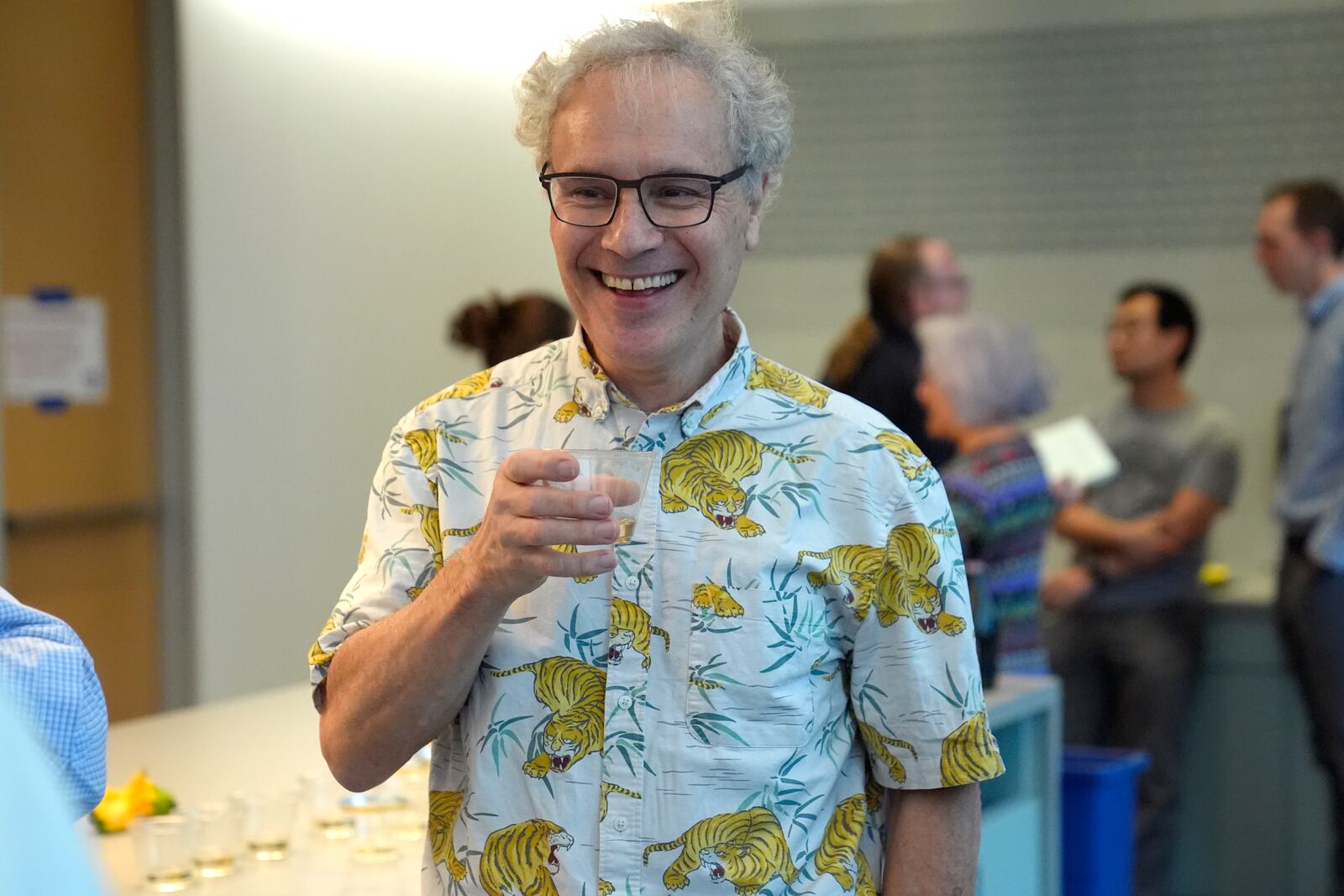 Victor Ambros, 2024 Nobel Prize winner in physiology or medicine, and professor of natural science at the University of Massachusetts Medical School, celebrates with colleagues, at the school, in Worcester, Mass. Monday, Oct. 7, 2024. (AP Photo/Steven Senne)