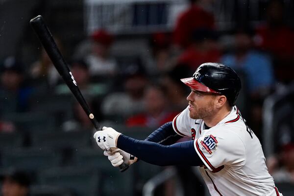 Atlanta Braves' Freddie Freeman (5) follows through on a double during the fifth inning of the team's baseball game against the New York Mets on Wednesday, June 30, 2021, in Atlanta. (AP Photo/John Bazemore)