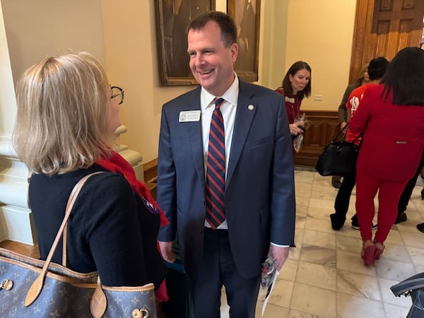 State Rep. Lehman Franklin, R-Statesboro, talks with Rep. Esther Panitch, D-Sandy Springs, at the Capitol in Atlanta on Thursday.