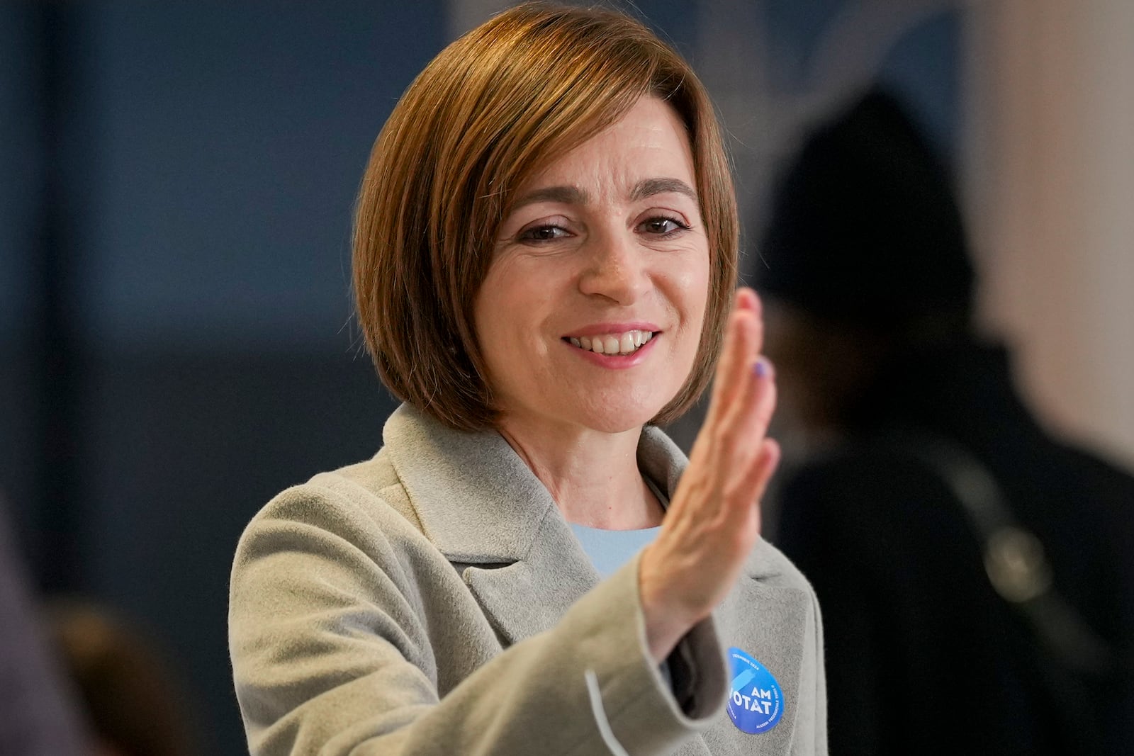 Moldova's President Maia Sandu smiles after casting her vote during a presidential election runoff, in Chisinau, Moldova, Sunday, Nov. 3, 2024. (AP Photo/Vadim Ghirda)