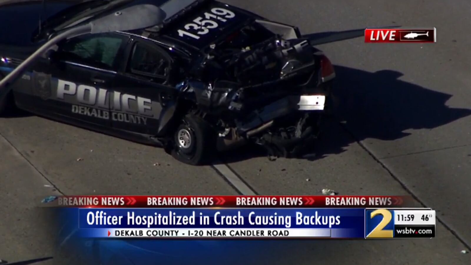 Newschopper 2 shows the damage to a DeKalb PD patrol car on I-20/westbound at Candler Road on December 5th, 2019. Officer Yosef Raskin is recovering from injuries after a distracted driver plowed into the police car at a routine traffic stop. The SUV also flipped over. Credit: Jason Durden, Newschopper 2.