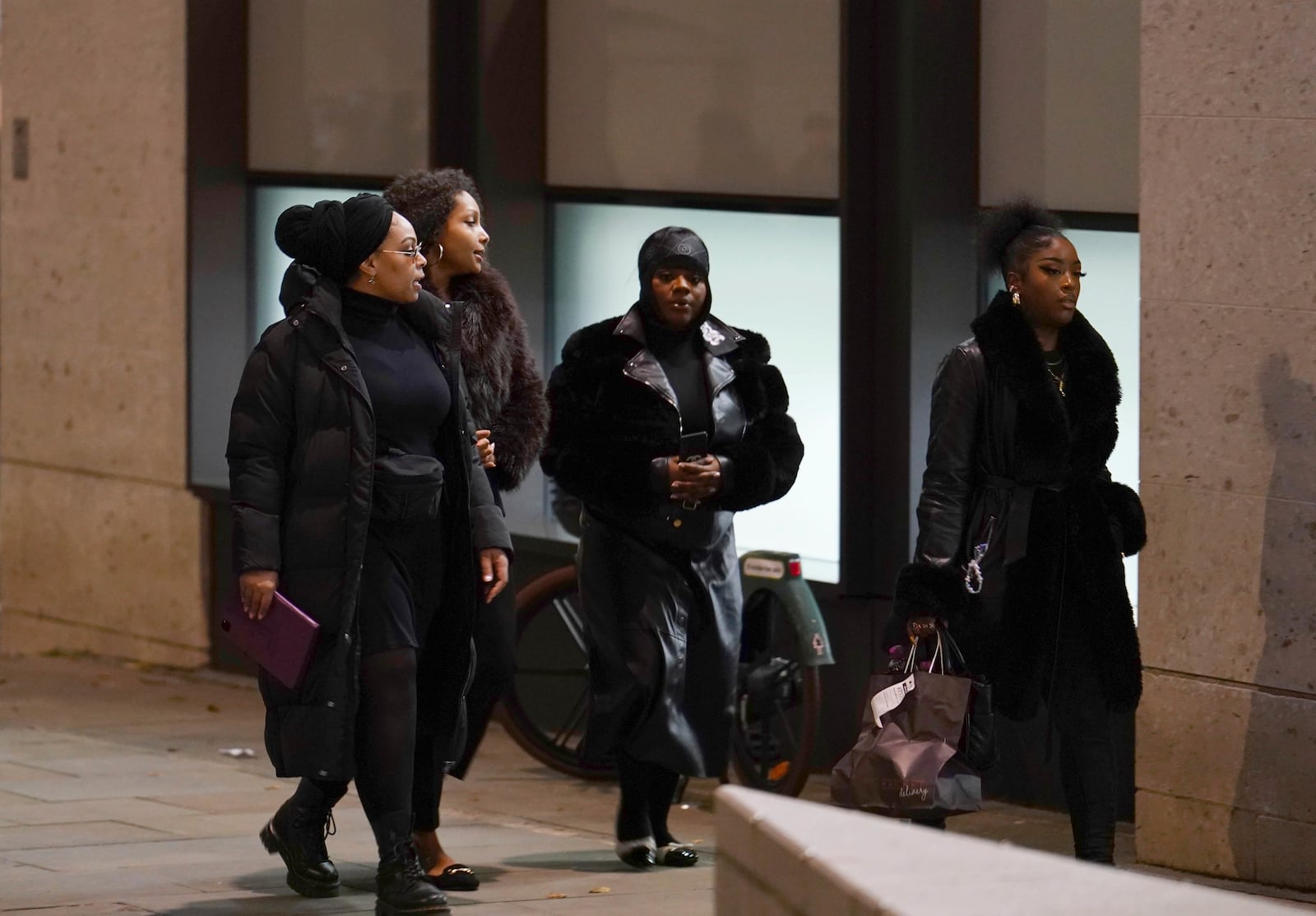 Friends and family members of Chris Kaba leave the Old Bailey in central London, Monday Oct. 21, 2024, after the London police officer who fatally shot Kaba was acquitted of murder. (Jordan Pettitt/PA via AP)