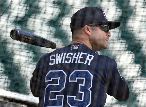 Nick Swisher takes batting practice Thursday during the Braves' first full-squad workout. (Curtis Compton/AJC photo)