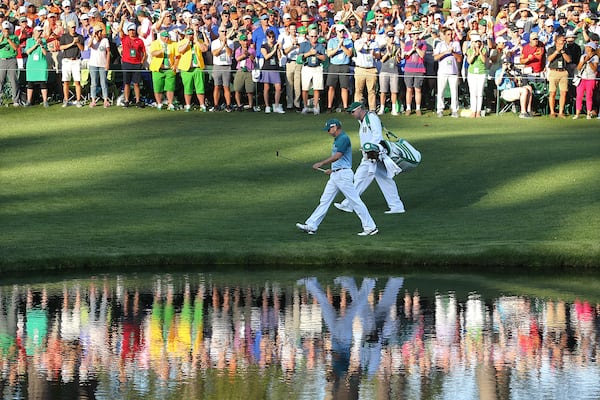 The gallery applauds Sergio Garcia as he walks to the 16th green on his way to winning the Masters at Augusta National Golf Club on Sunday, April 9, 2017, in Augusta. (Curtis Compton/ccompton@ajc.com)