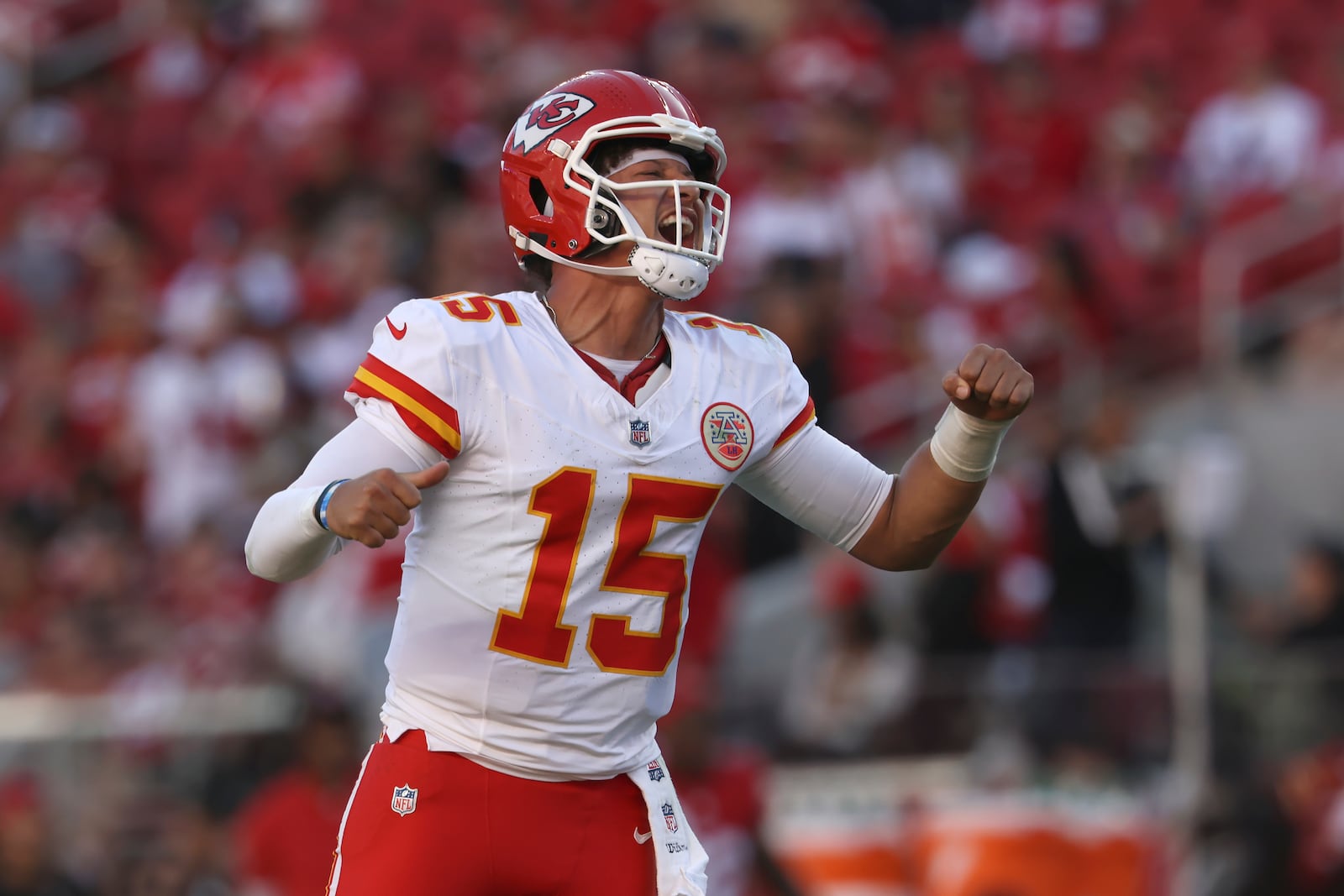 Kansas City Chiefs quarterback Patrick Mahomes (15) celebrates after a touchdown by Mecole Hardman during the second half of an NFL football game against the San Francisco 49ers in Santa Clara, Calif., Sunday, Oct. 20, 2024. (AP Photo/Jed Jacobsohn)