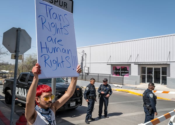 Indigo Beltran, 19, of Eagle Pass, holds a poster protesting the visit by Vice President JD Vance to the Texas - Mexico border in Eagle Pass, Texas, Wednesday, March 5, 2025. (AP Photo/Rodolfo Gonzalez)