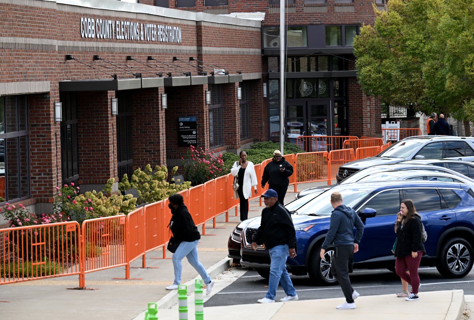 Voters arrive at one of early voting locations at Cobb County Elections and Registration Main Office, Tuesday, October 15, 2024, in Marietta. (Hyosub Shin / AJC)