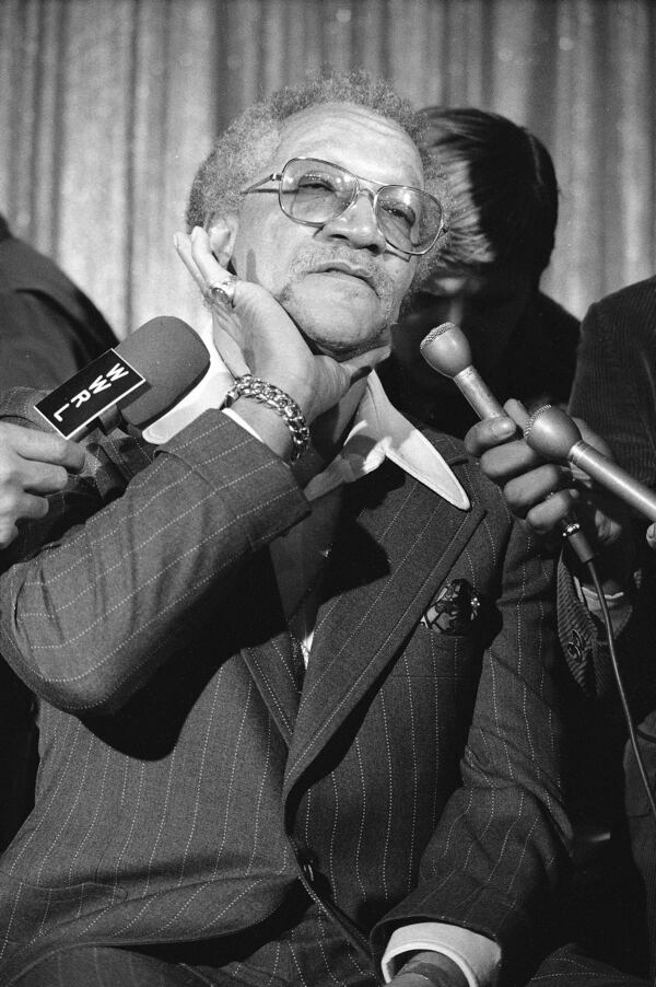 Comedian Redd Foxx rests his head in his hand, complaining of back pain as he tells newsmen reasons he left the top-rated sitcom "Sanford & Son," March 14, 1974 in New York.  Foxx said he'd return to the series if NBC corrects certain conditions, including the show's depiction of African American life.  (AP Photo/Marty Lederhandler)