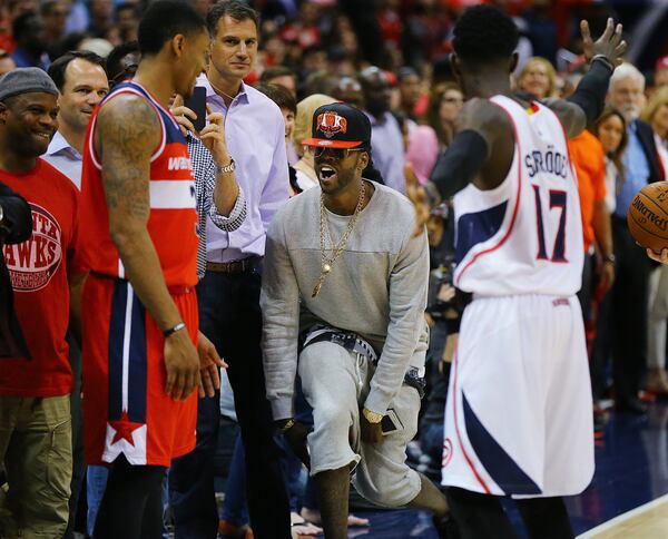 American rapper 2 Chainz taunts Wizards guard Bradley Beal from his seat as he prepares to inbounds the ball in the final minute of a Hawks 82-81 victory in their Eastern Conference Semifinals game 5 on May 13. AJC Photo: Curtis Compton / ccompton@ajc.com