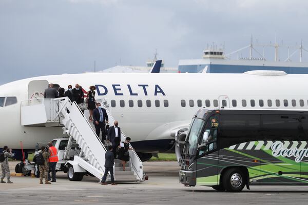 7/29/20 - Atlanta, GA - John Lewis’ staff arrives at Dobbin’s Air Force Base ahead of the plane carrying his body.  On the fifth day of the “Celebration of Life” for Rep. John Lewis, Lewis’s body and and family members return to Georgia for ceremonies at the State Capitol where he will also lie in state until his funeral on Thursday.  Alyssa Pointer / alyssa.pointer@ajc.com