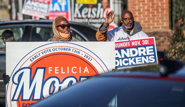 Yomoko Wiggins (left) and Clarence Toomer (right) campaigned at C.T. Martin Natatorium and Recreation Center on Tuesday, November 30, 2021. (John Spink / John.Spink@ajc.com)

