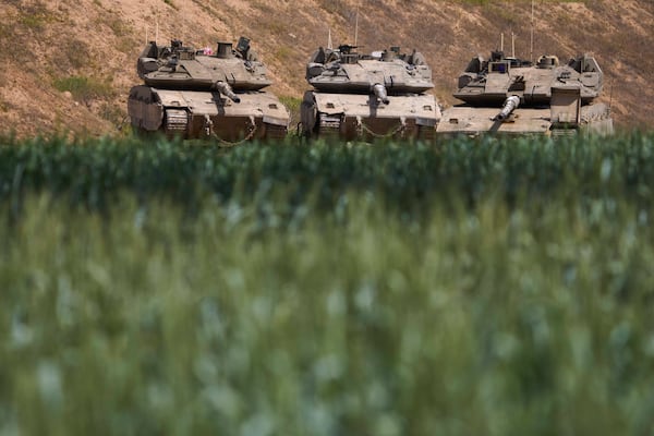 Israeli tanks at a position near the Gaza border in southern Israel, Wednesday, March 19, 2025. (AP Photo/Ariel Schalit)