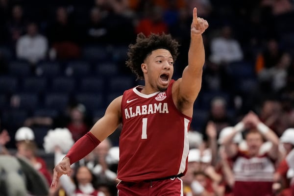 Alabama guard Mark Sears (1) reacts to a three-point shot against Florida during the first half of an NCAA college basketball game in the semifinal round of the Southeastern Conference tournament, Saturday, March 15, 2025, in Nashville, Tenn. (AP Photo/George Walker IV)