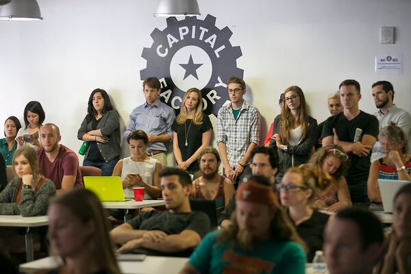 (USE THIS PHOTO ON JUMP) Audience members line the walls in a over-filled conference room to listen to representatives from various ride-hailing groups that gathered at the Capital Factory to pitch their services and take questions from the techie audience.
RALPH BARRERA/AMERICAN-STATESMAN