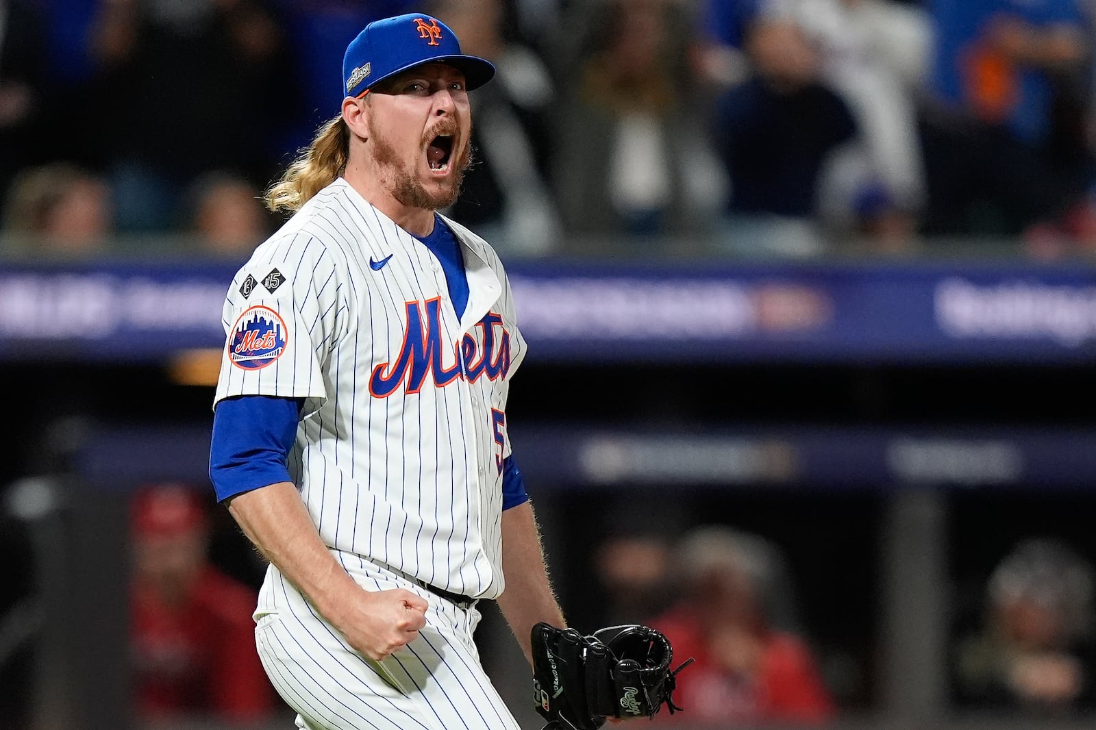 New York Mets pitcher Ryne Stanek (55) reacts after striking out the Philadelphia Phillies to end the ninth inning and Game 3 of the National League baseball playoff series, Tuesday, Oct. 8, 2024, in New York. (AP Photo/Frank Franklin II)