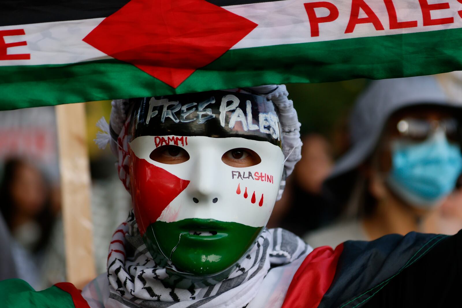 A pro-Palestinian protester marched during a demonstration outside the Democratic National Convention on Wednesday.