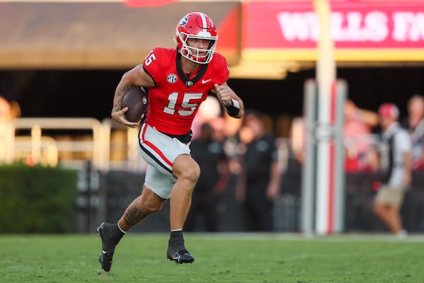 Georgia quarterback Carson Beck (15) runs for yards during the second quarter against UT Martin at Sanford Stadium, Saturday, September 2, 2023, in Athens, Ga. Georgia won 48-7. (Jason Getz / Jason.Getz@ajc.com)