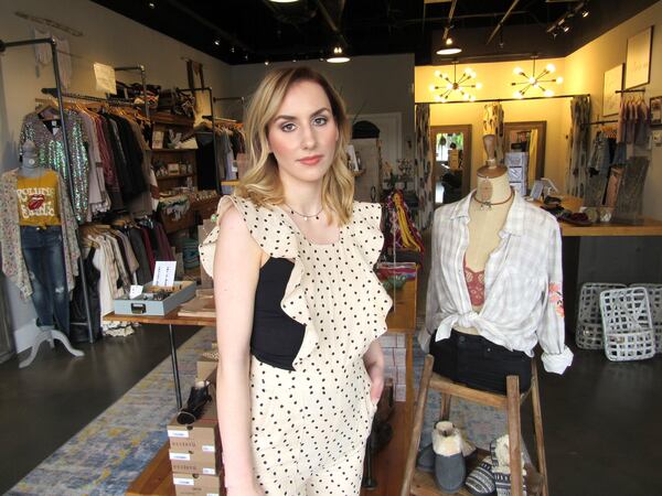 Abby Hayman at Ivory Thread, an Acworth boutique where she models, attended a school for students with learning disabilities and hopes to transfer to Kennesaw State University this fall. 