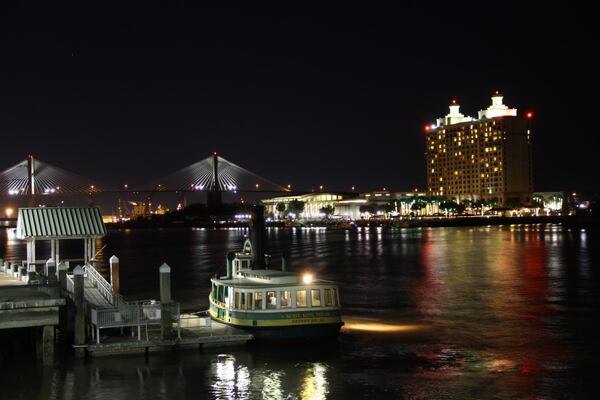 Water taxi, Susie King Taylor pulls up to the dock adjacent to the Marriott in Savannah. In the background a cargo ship has just passed the Talmadge Memorial Bridge and heading out to sea on it's next journey. Susie King Taylor was the first African American nurse and served during the civil war, wrote Freddy Frank
of Peachtree City.