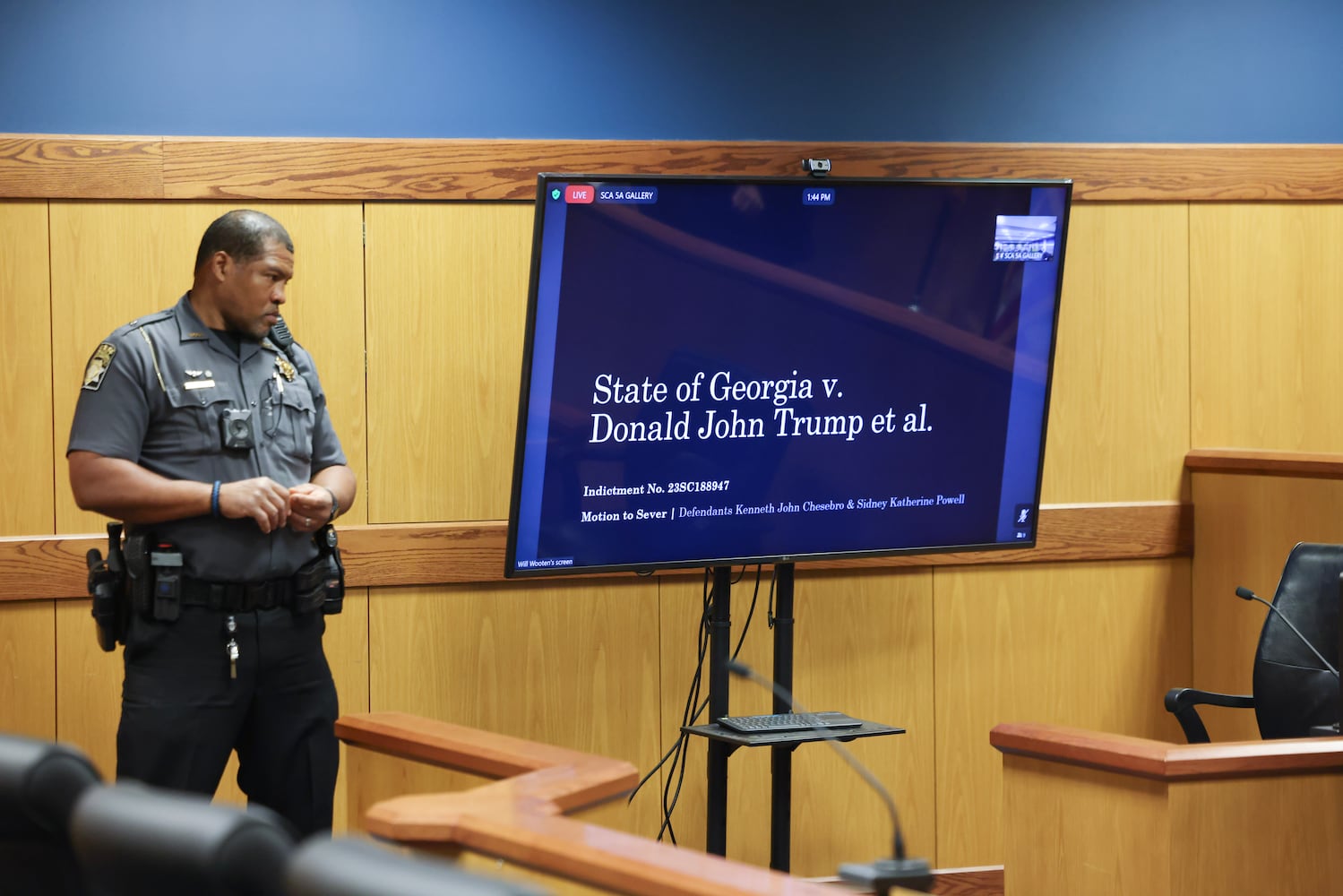 A PowerPoint presentation is given by Deputy District Attorney Will Wooten is displayed as he argued before Fulton County Superior Judge Scott McAfee as he hears motions from attorneys representing Ken Chesebro and Sidney Powell in Atlanta on Wednesday, Sept. 6, 2023. (Jason Getz / Jason.Getz@ajc.com)