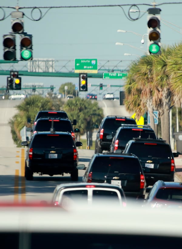 President Donald Trump's motorcade heads west on Southern Boulevard on its way to Trump International Golf Club in West Palm Beach Sunday morning, December 31, 2017. (Bruce R. Bennett / The Palm Beach Post)